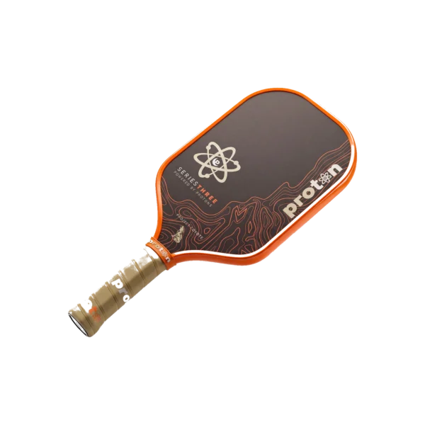Proton Project Coyote Elongated 15mm Pickleball Paddle gallery image 2 Proton Project Coyote paddle with beige grip and orange edge, angled view