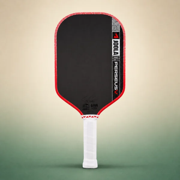 JOOLA Perseus Pro V 16mm Pickleball Paddle – Blaze Red (Ben Johns), front view on a sand and green studio background JOOLA Perseus Pro V 16mm Pickleball Paddle – Blaze Red (Ben Johns), front view